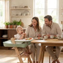 Family enjoying a calm mealtime with baby in high chair using the food catcher